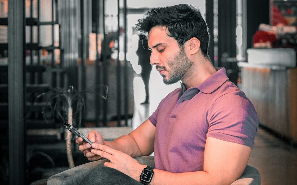 A man is looking at his phone.