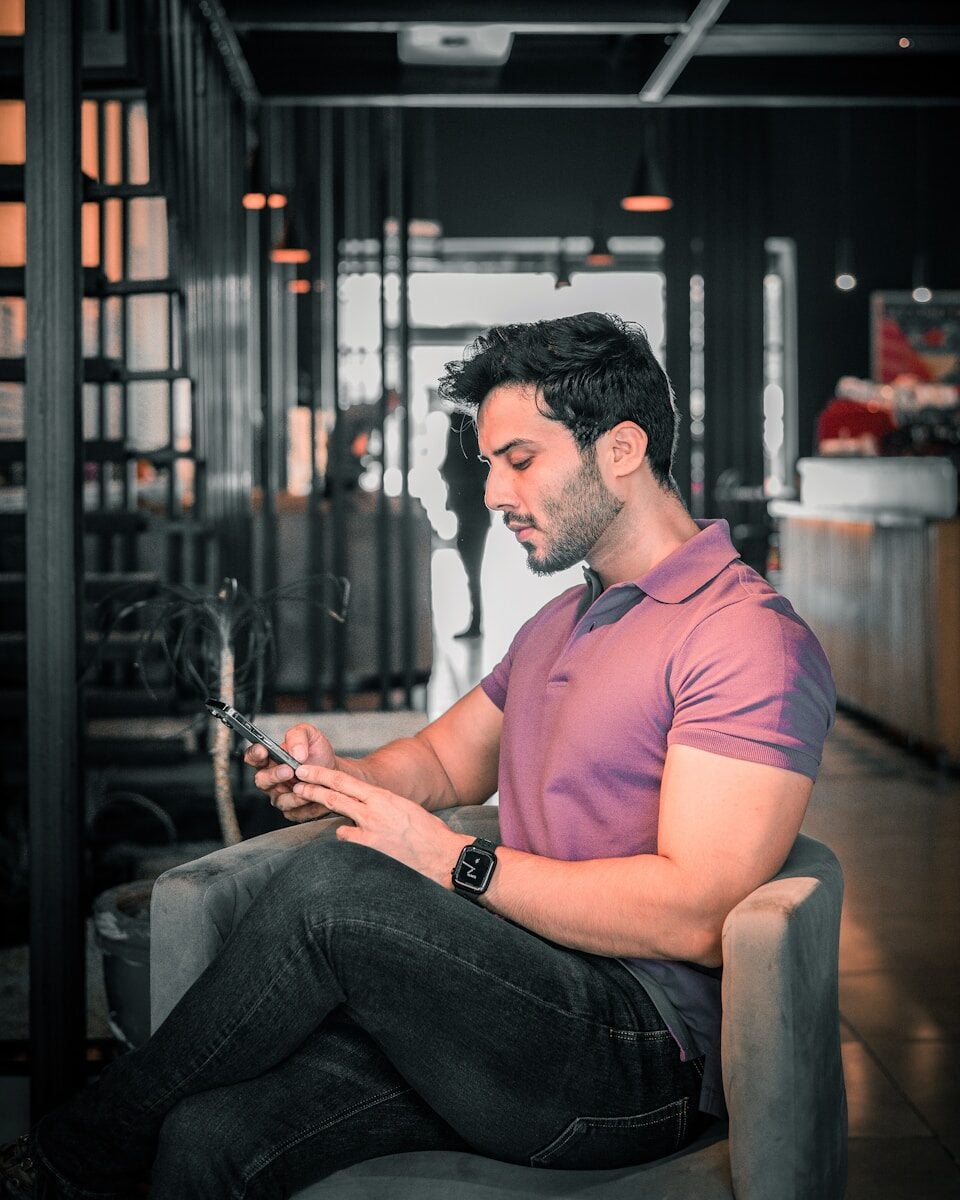 A man is looking at his phone.