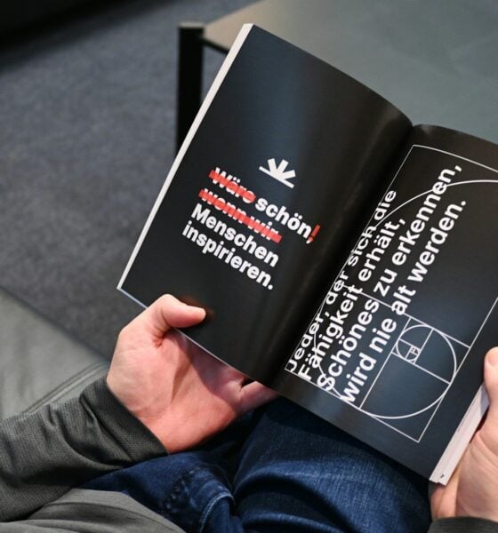 a person is reading a book on the floor