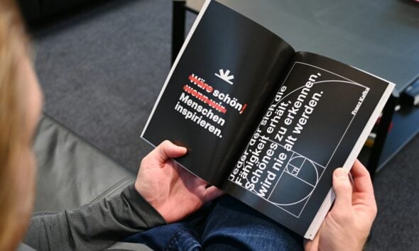 a person is reading a book on the floor
