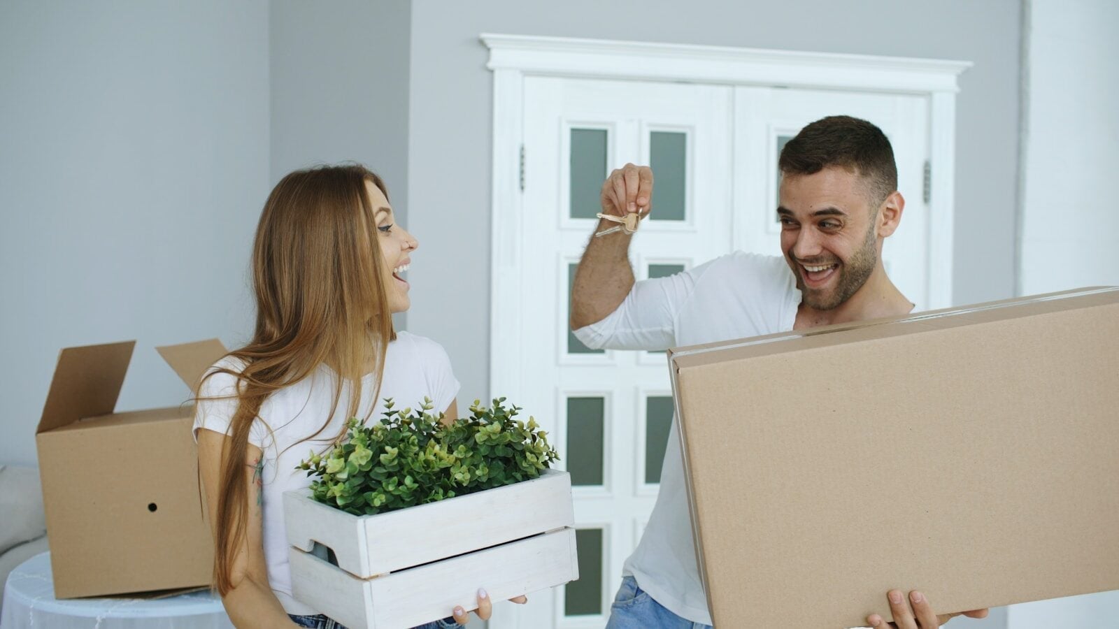 Couple happily moving into a new home
