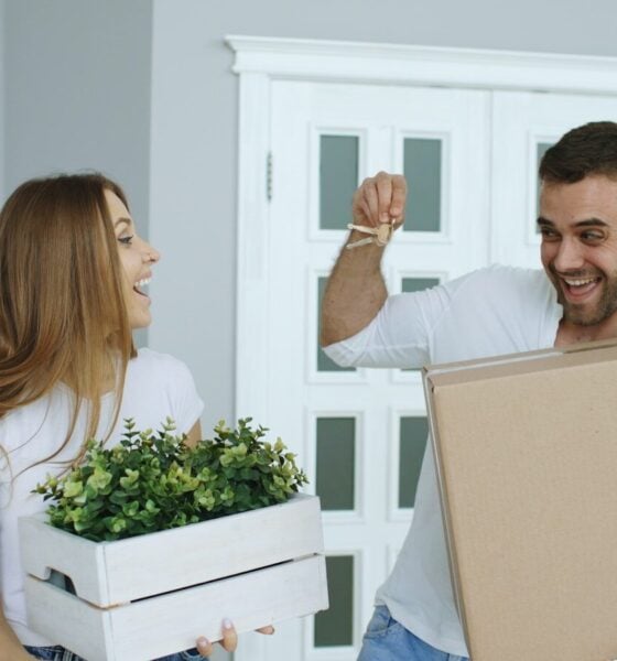 Couple happily moving into a new home