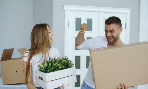 Couple happily moving into a new home