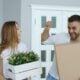 Couple happily moving into a new home