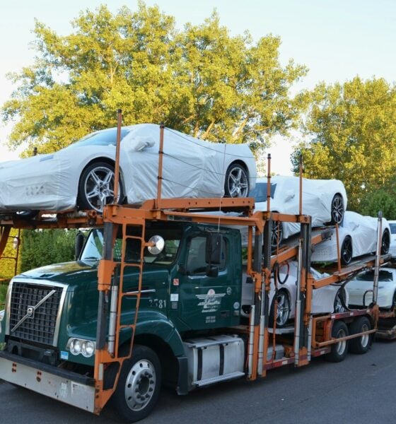 A truck with a car on the back of it