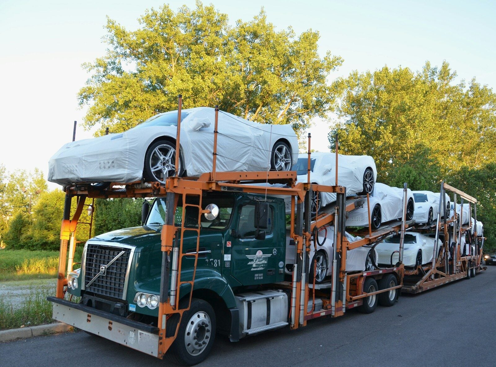 A truck with a car on the back of it
