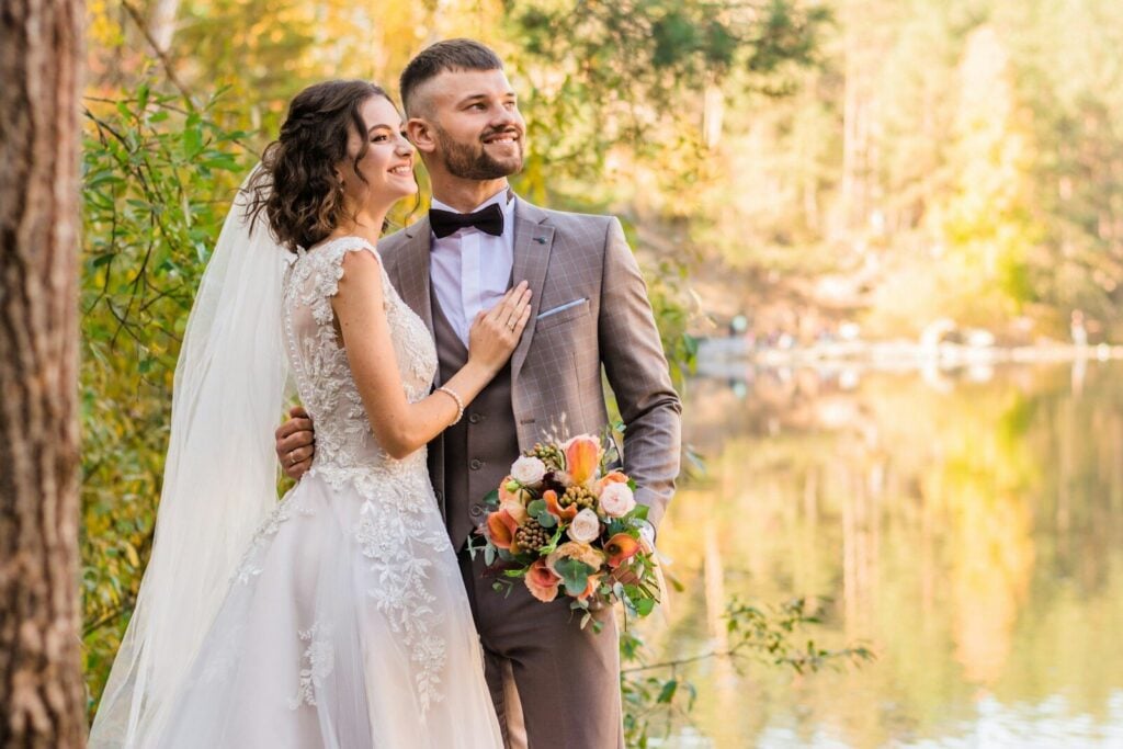 How to Plan a Luxury Wedding: The Complete Planning Guide 27 man in gray suit and woman in white wedding dress
