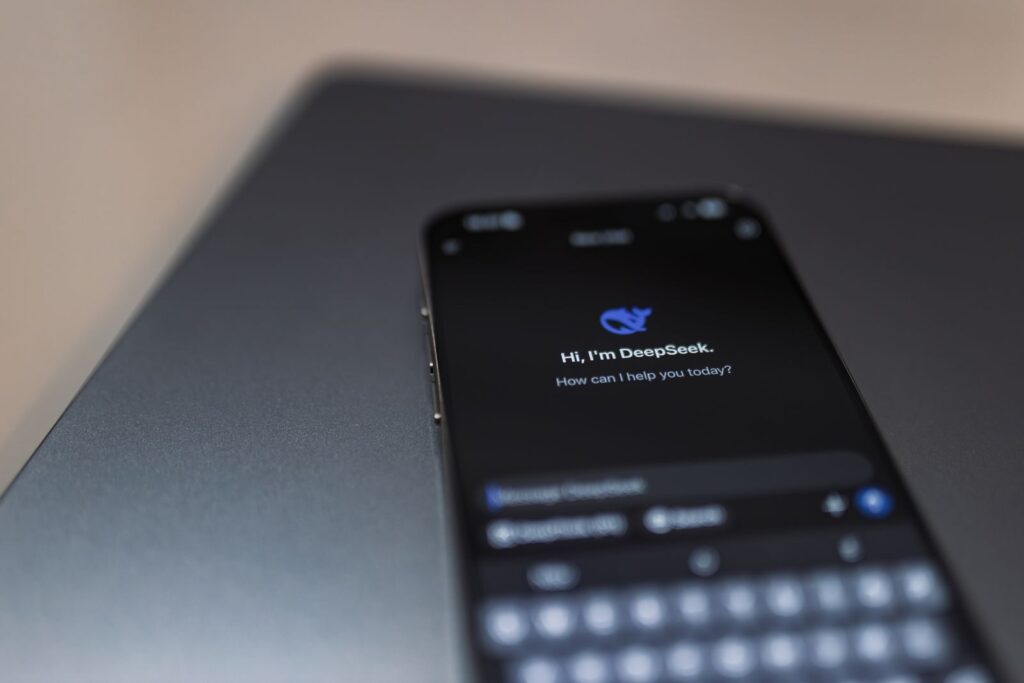 VetClaims.ai Review: Features, Pros, Cons, and Pricing 27 Close-up of a smartphone displaying an AI chat interface with the DeepSeek app.
