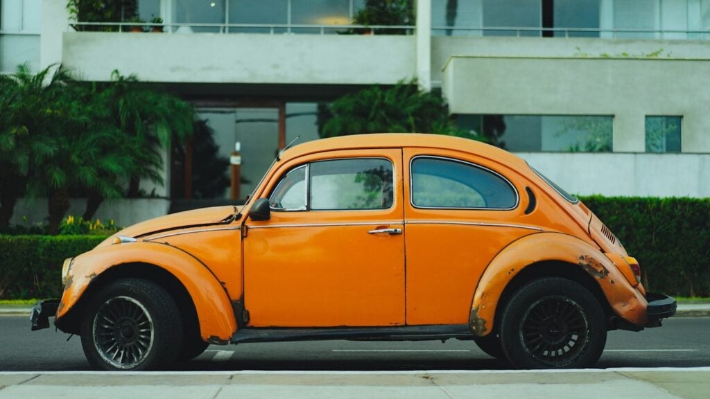How to Trade a Financed Car in 2026? Complete Guide 28 shallow focus photography of orange Volkswagen Beetle