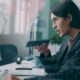 A woman sitting at a desk in front of a computer