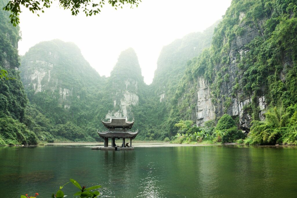 Cash Can I Bring to Vietnam Without Declaring? Rules Explained 28 pagoda surrounded by body of water and mountains