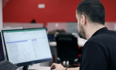 a man sitting in front of a laptop computer