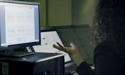 person using computer on table