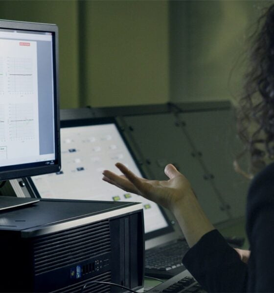 person using computer on table