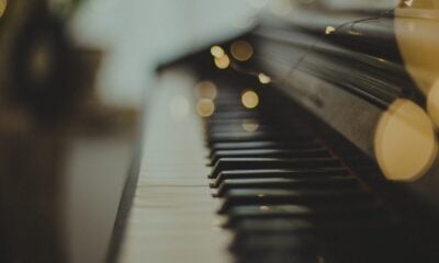selective focus photography of black wooden piano keys