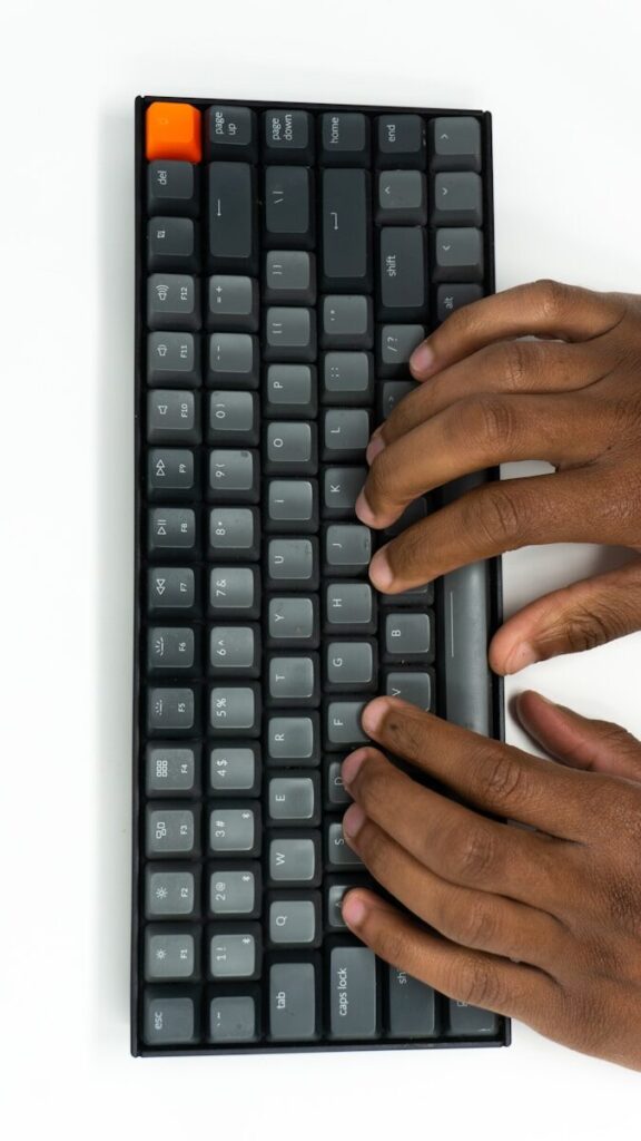 How to Clean a Keyboard - Maintenance Guide 27 hands on a keyboard