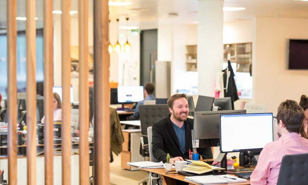 a man sitting at a desk in an office