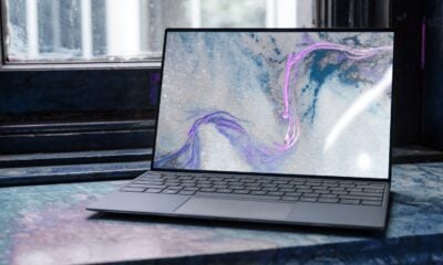 laptop on brown wooden table