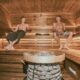 Two men relaxing in a wooden sauna