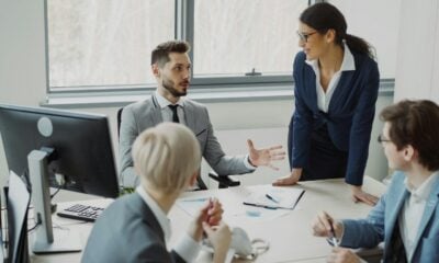 Business professionals collaborating in a modern office meeting