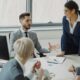 Business professionals collaborating in a modern office meeting