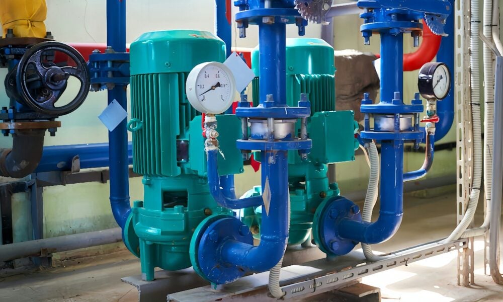 a group of pipes and valves in a room