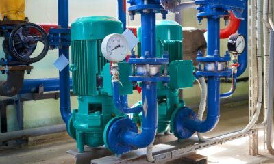 a group of pipes and valves in a room