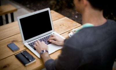 man in front of laptop computer in shallow focus photography
