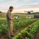 man in farm with tablet