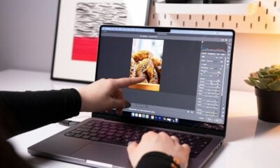 A person sitting in front of a laptop computer