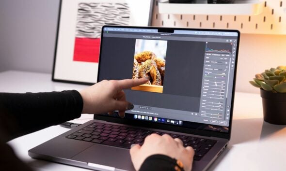 A person sitting in front of a laptop computer