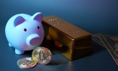 Piggy bank, gold, bitcoin, and money for investment