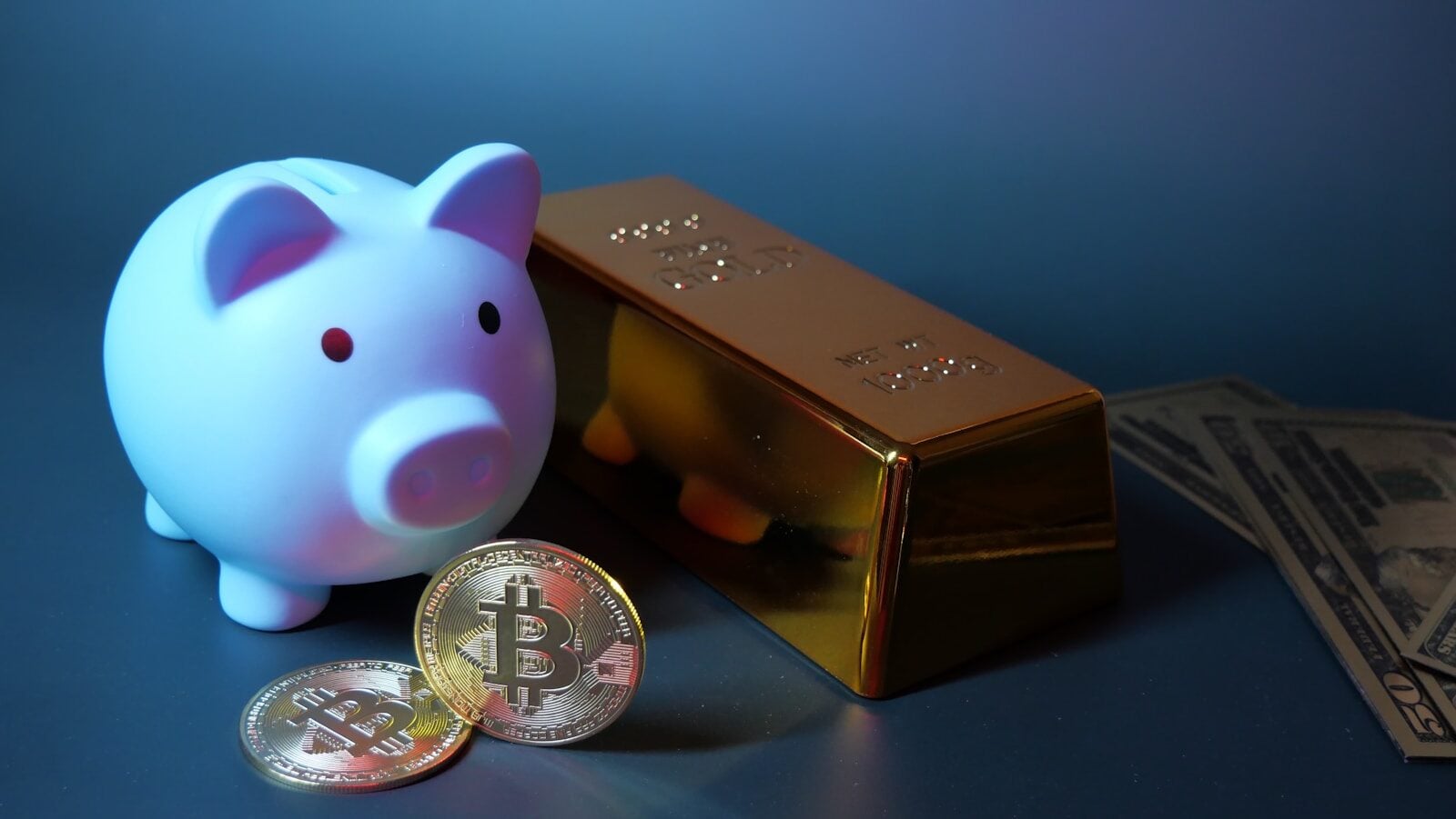 Piggy bank, gold, bitcoin, and money for investment