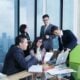 A group of business people sitting around a table