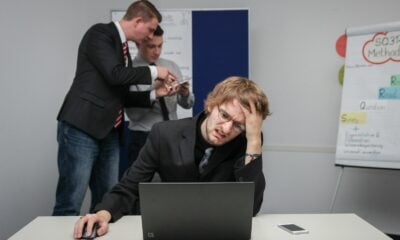 A man sitting in front of a laptop computer