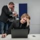 A man sitting in front of a laptop computer