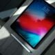 black iPad with white stylus pen