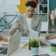 A group of people working together at a desk in a creative workspace