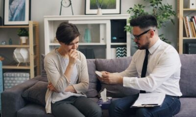 a man and a woman sitting on a couch