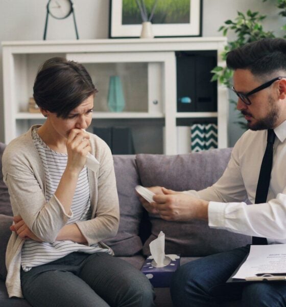 a man and a woman sitting on a couch