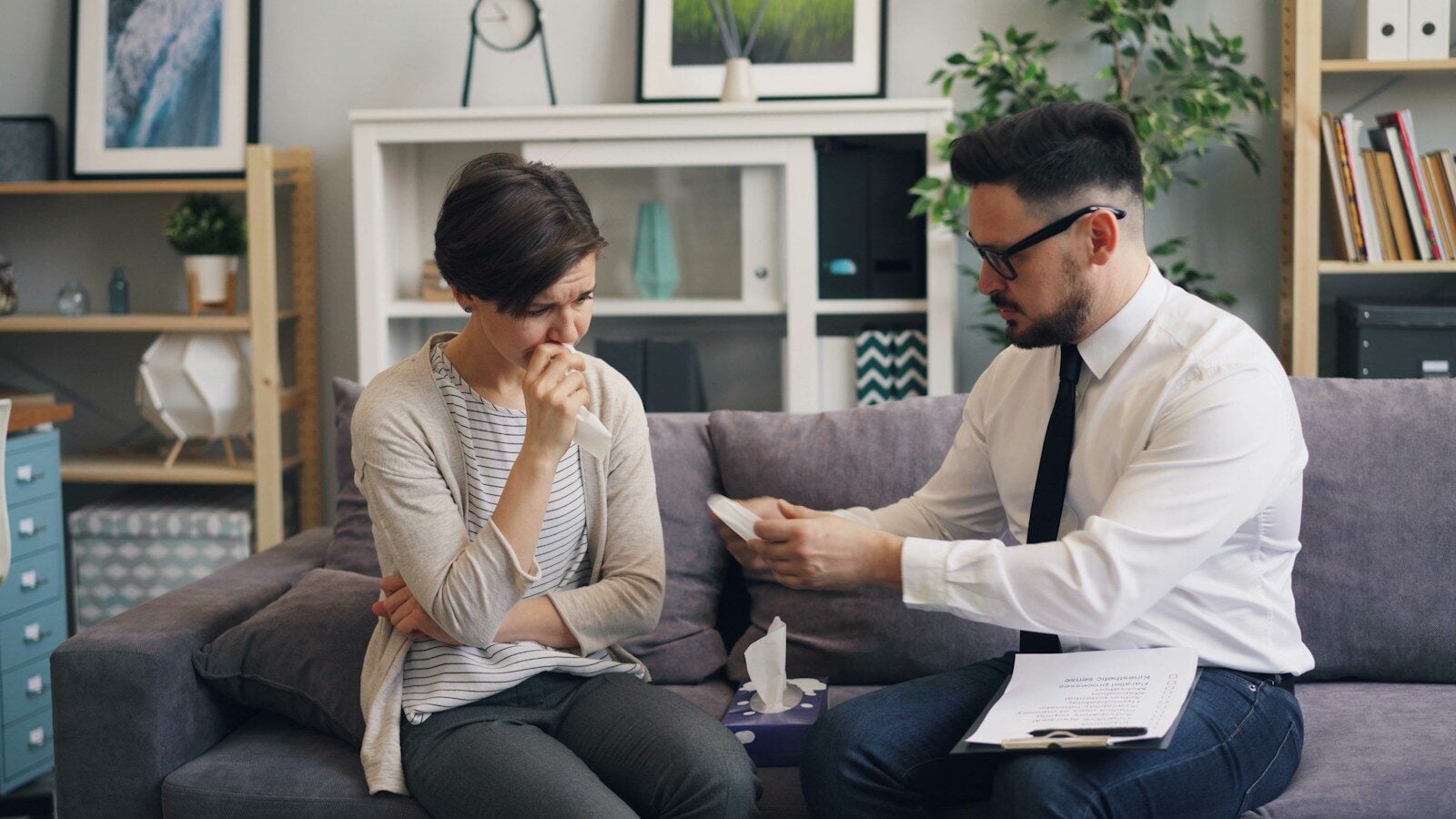 a man and a woman sitting on a couch