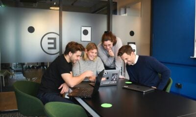people sitting on chair in front of laptop computers