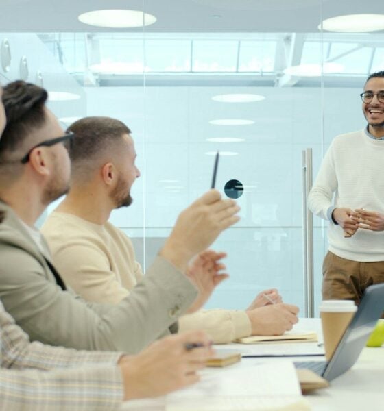 Man presenting to colleagues in a modern office setting