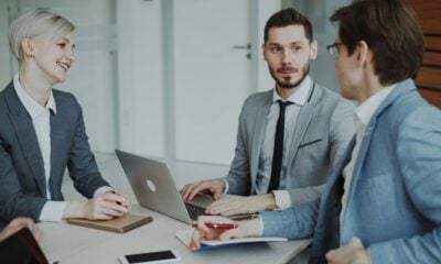 Business professionals in a meeting around a table